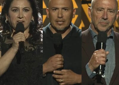 Four people are holding microphones and one is holding a microphone.